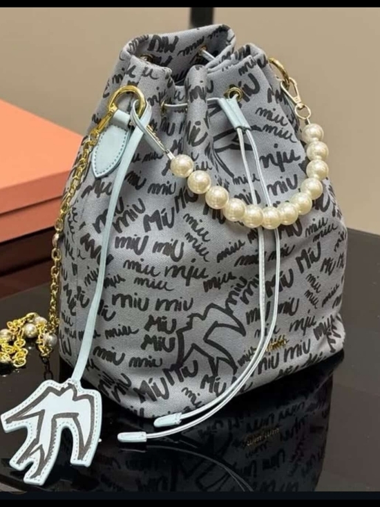 Miu Miu Handbags - Miu Miu Gray Logo Drawstring Mini Bag with Light Blue Accents and Pearl Handle